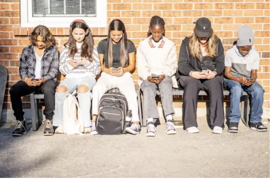 High School students spend time online instead of socializing with peers. Photo from Unsplash by Unseen Studios.