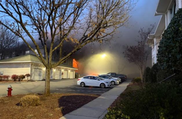 At the Camden Woodward Apartments, fire burned as firefighters and first responders rushed to the scene, controlling the fire and limiting it to one building.
