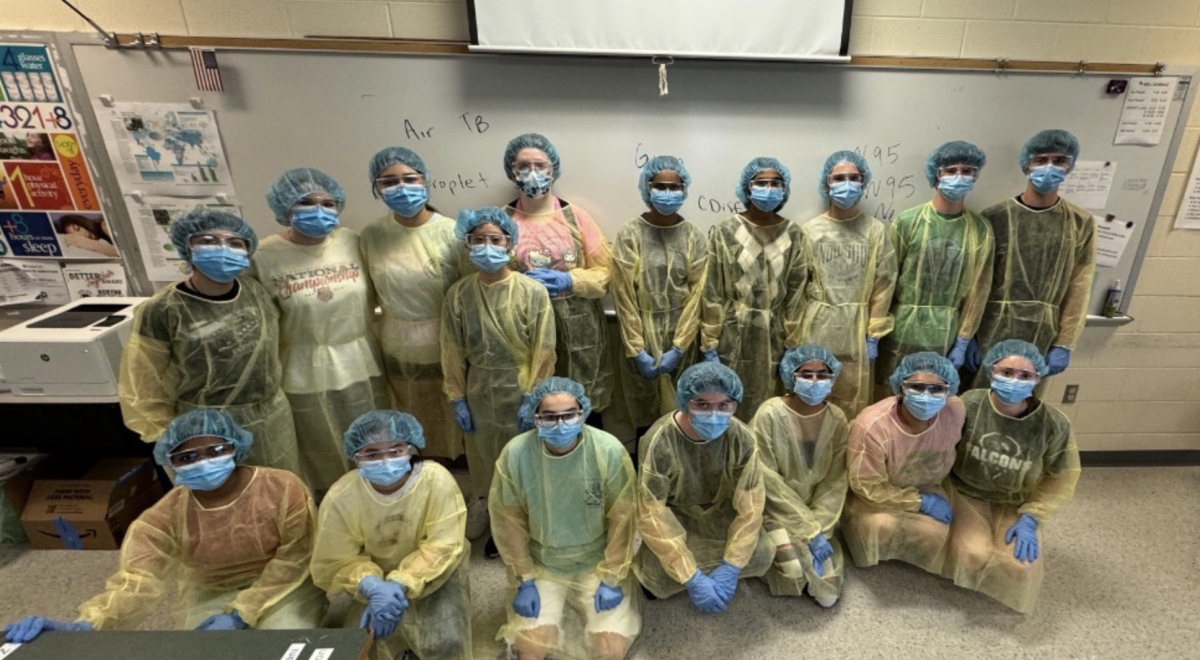 Students in Health Science II learn how to correctly put on PPE.