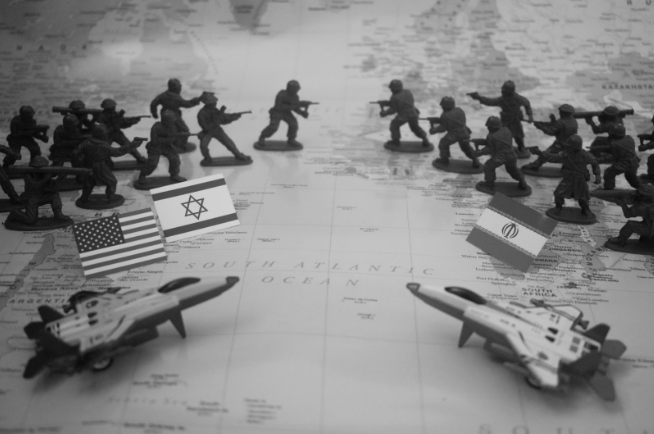 A photo of a strategic planning-esque scene that depicts the current conflict between the US teamed with Israel vs Iran. Used with permission from Saifee Art on Unsplash 