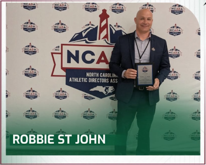 Green Hope's own Robbie St. John recently received the Citation Award, recognizing his work as an athletic director. Photo used with permission from  @greenhopefalcons via Instagram.