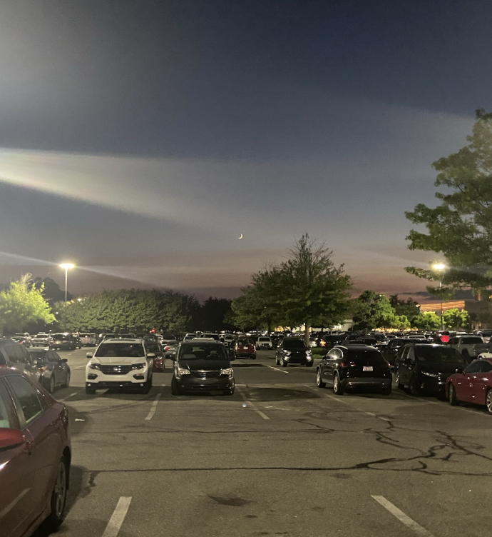 Student cars line the parking lot after a football game. Teen drivers have to make their way home during the night, which worries parents. Photo used with permission from Arushi Sharan.