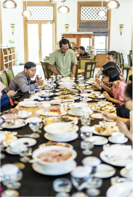 Eating together after fasting, sharing food, and  Bonding. 
Permission from Febrian Zakaria via Unsplash.