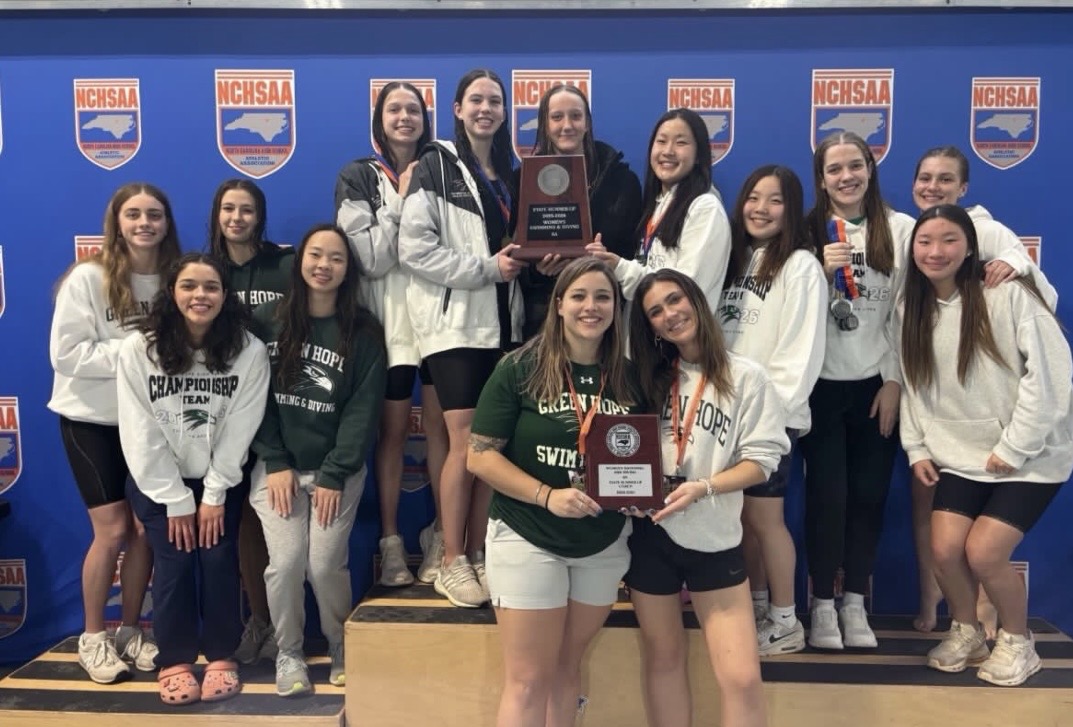 Green Hope girls swim team proudly poses with their runner-up trophy at the 2026 NCHSAA State Championship. Photo used with permission from Green Hope Athletics on Instagram (@greenhopefalcons).