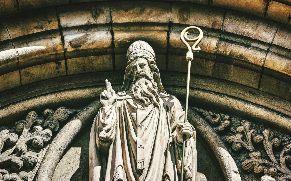 A statue of Saint Patrick at Belfast church. Does St. Patrick’s day really commemorate the man himself, or is it just another excuse to promote meaningless consumerism? Photo used with permission from K. Mitch Hodge via Unsplash.