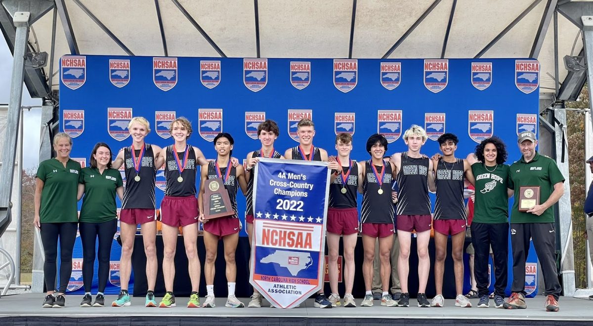 The Green Hope Men’s Cross Country team hoists its third state championship in 2022, led by Coach Miragliuollo, Coach Gardiner and Coach Ross. Photo permission from Green Hope Website.