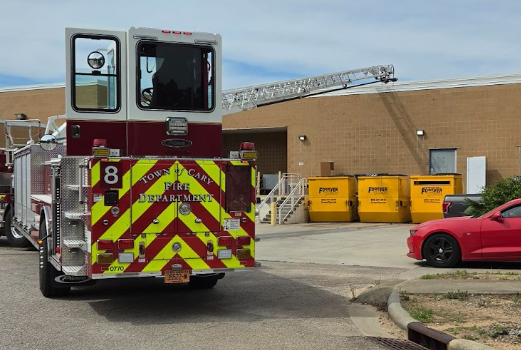 The firefighters used a ladder to gain entrance into the school, making sure the scene was safe. 