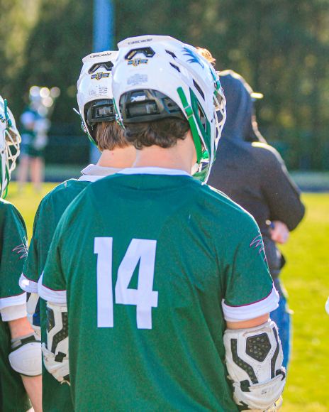 Junior Chase Dean stands on the sidelines, watching his team play cross-town rivals Panther Creek. Photo used with permission from @shotbyandrewww via Instagram.