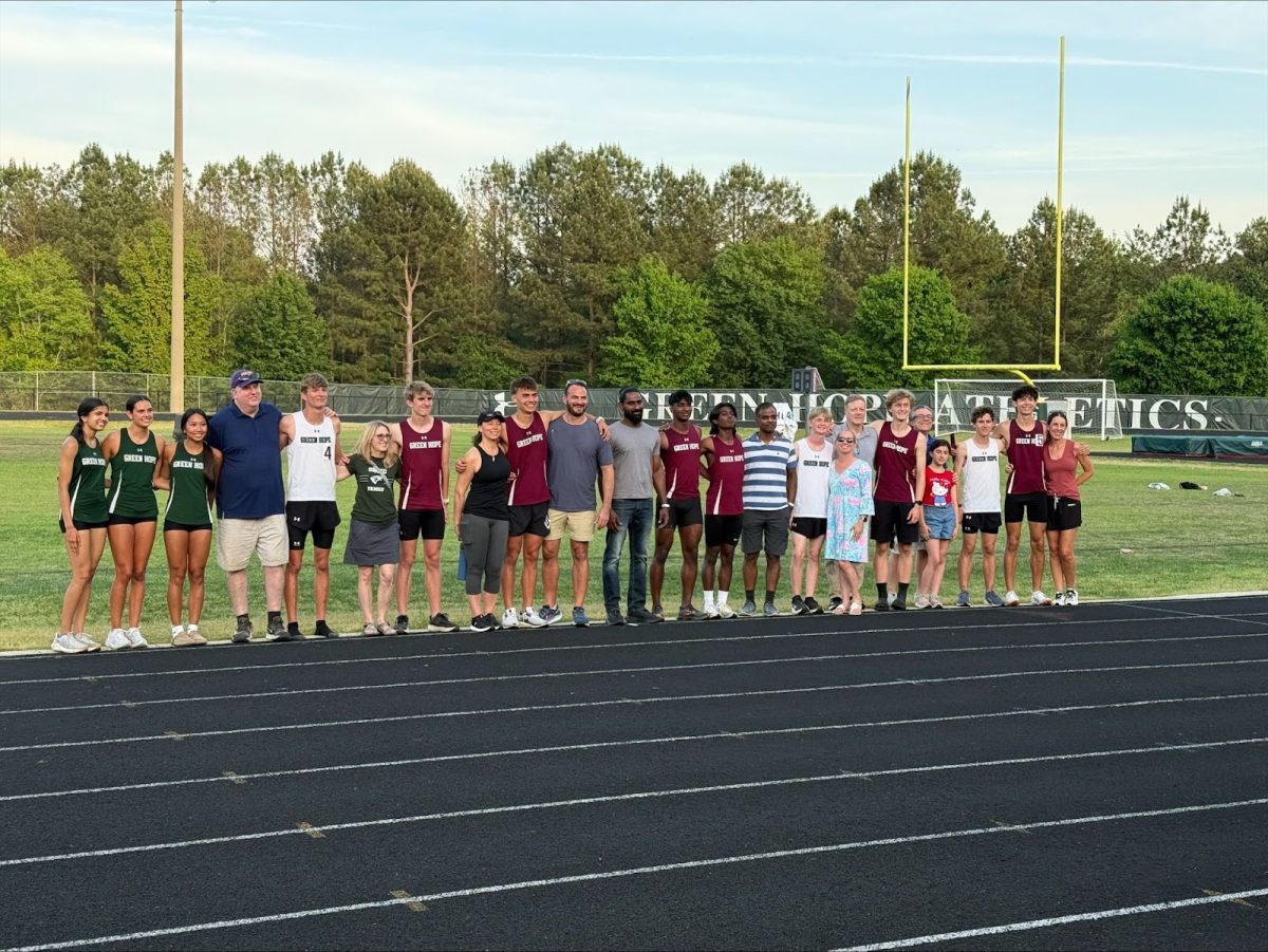 Senior Falcons alongside their family and friends join together for one last photo together. 