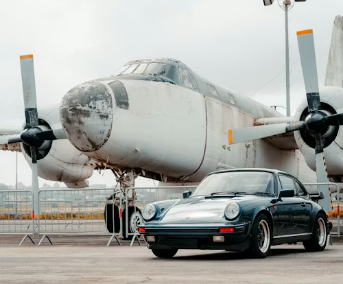 This image shows a plane next to a car showing their differences. Although they may seem scarier, planes are actually proven to be safer than cars. Image used with permission by Tiago Ferreira on Unsplash.