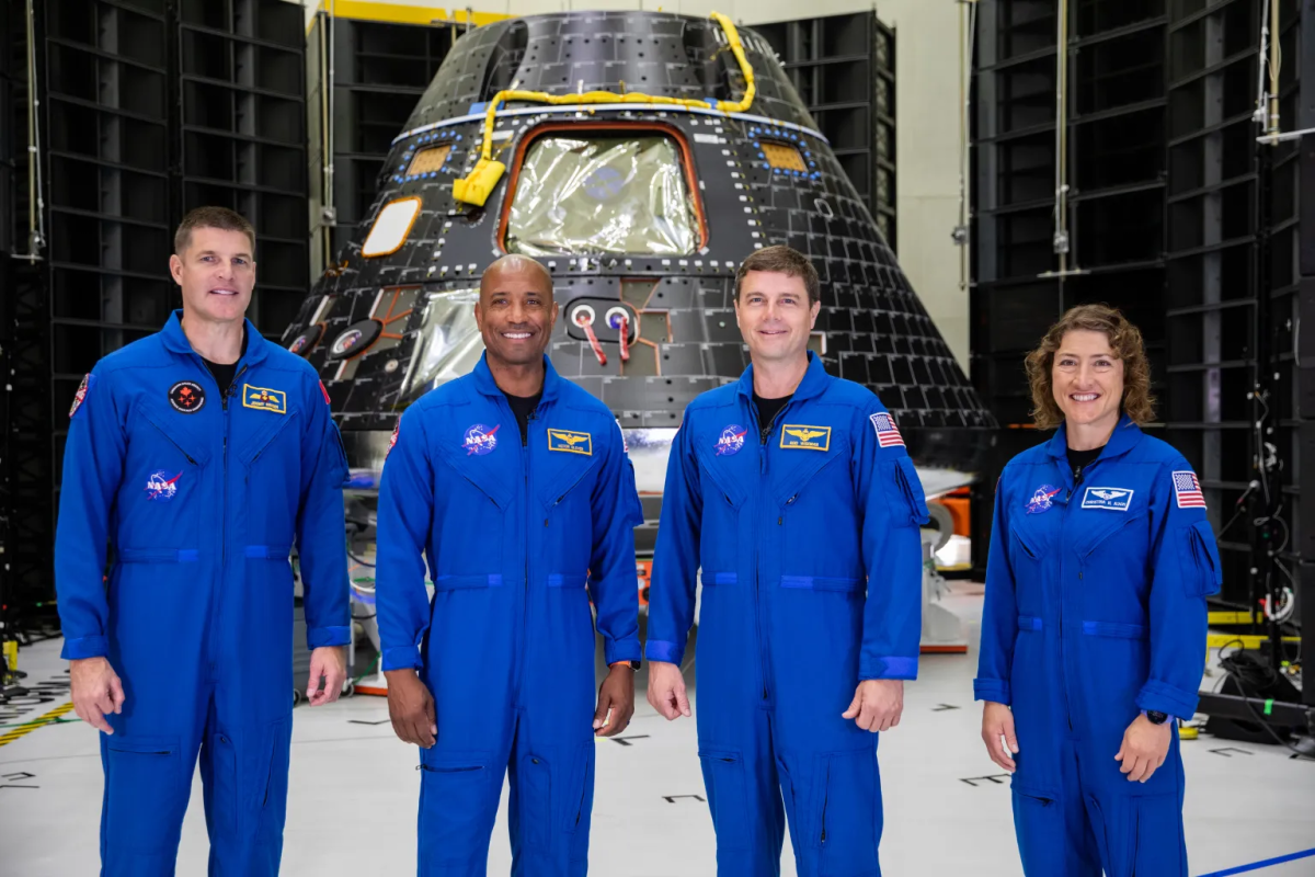 Artemis II crew at NASA’s Kennedy Space Center in Florida in front of the Orion module. Left to right: Jeremy Hansen, CSA mission specialist; Victor Glover, NASA pilot; Reid Wiseman, NASA commander; and Christina Koch NASA mission specialist. Photo taken by Kim Shiflett with permission from NASA.