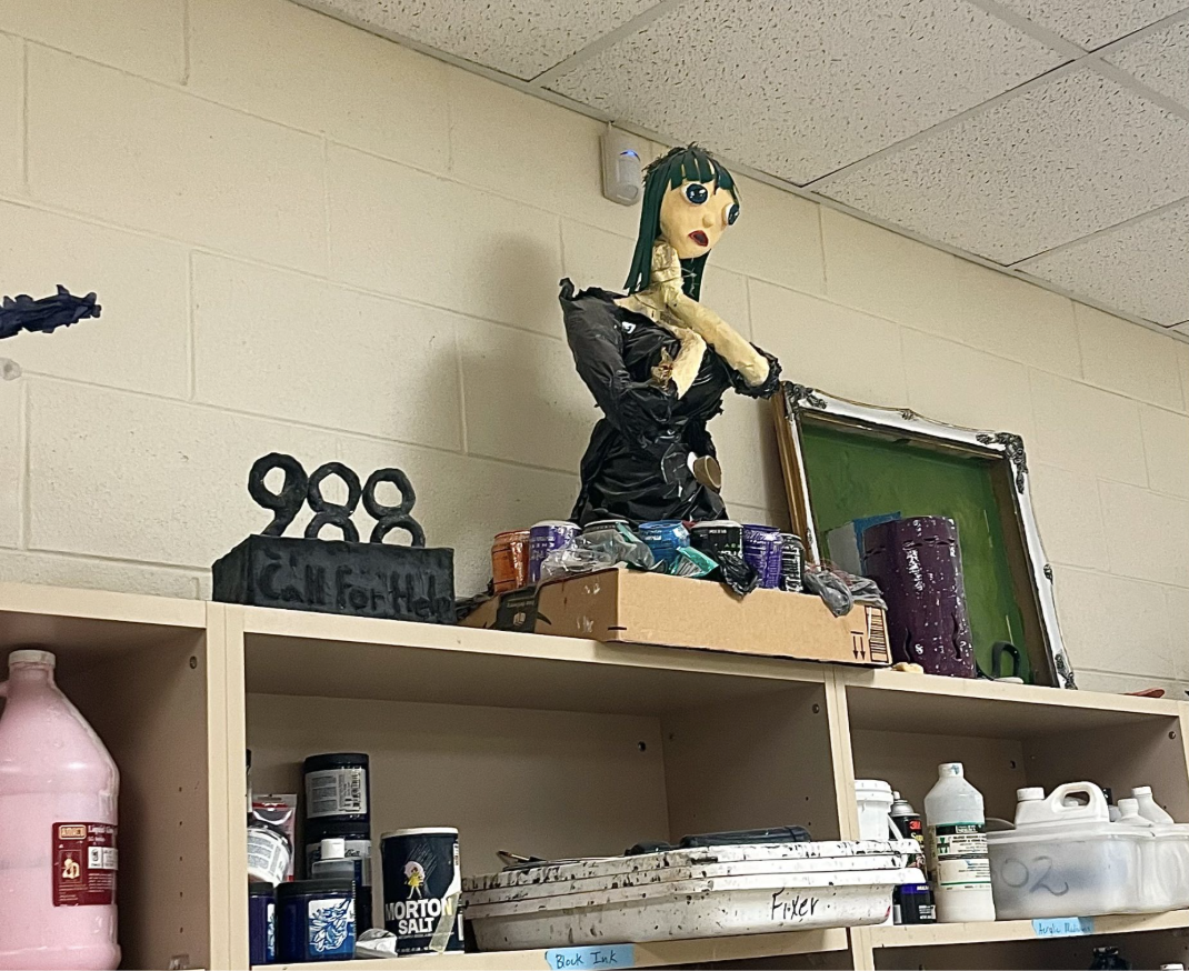 Photo of art pieces on top of Mr Morrow’s paint shelf that relate to mental health.