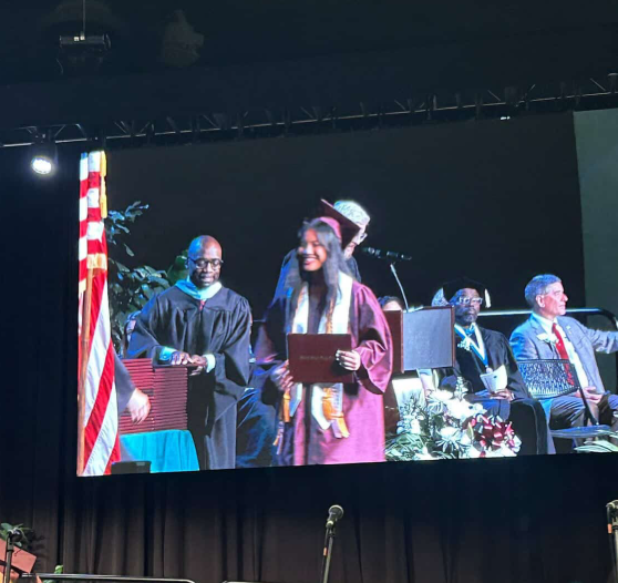 Green Hope Alumni Caitlin Belingon (25’) crossing the stage at last year’s graduation. (Photo used with permission from Caitlin Belingon)
