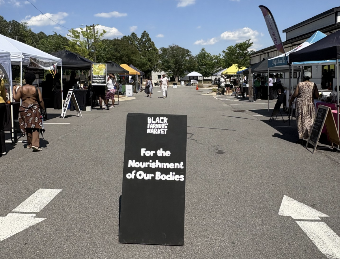 Shoppers moved through the Black Farmers Market in downtown Raleigh, where vendors offered fresh food and handmade goods aimed to provide more healthy alternatives into the community.
