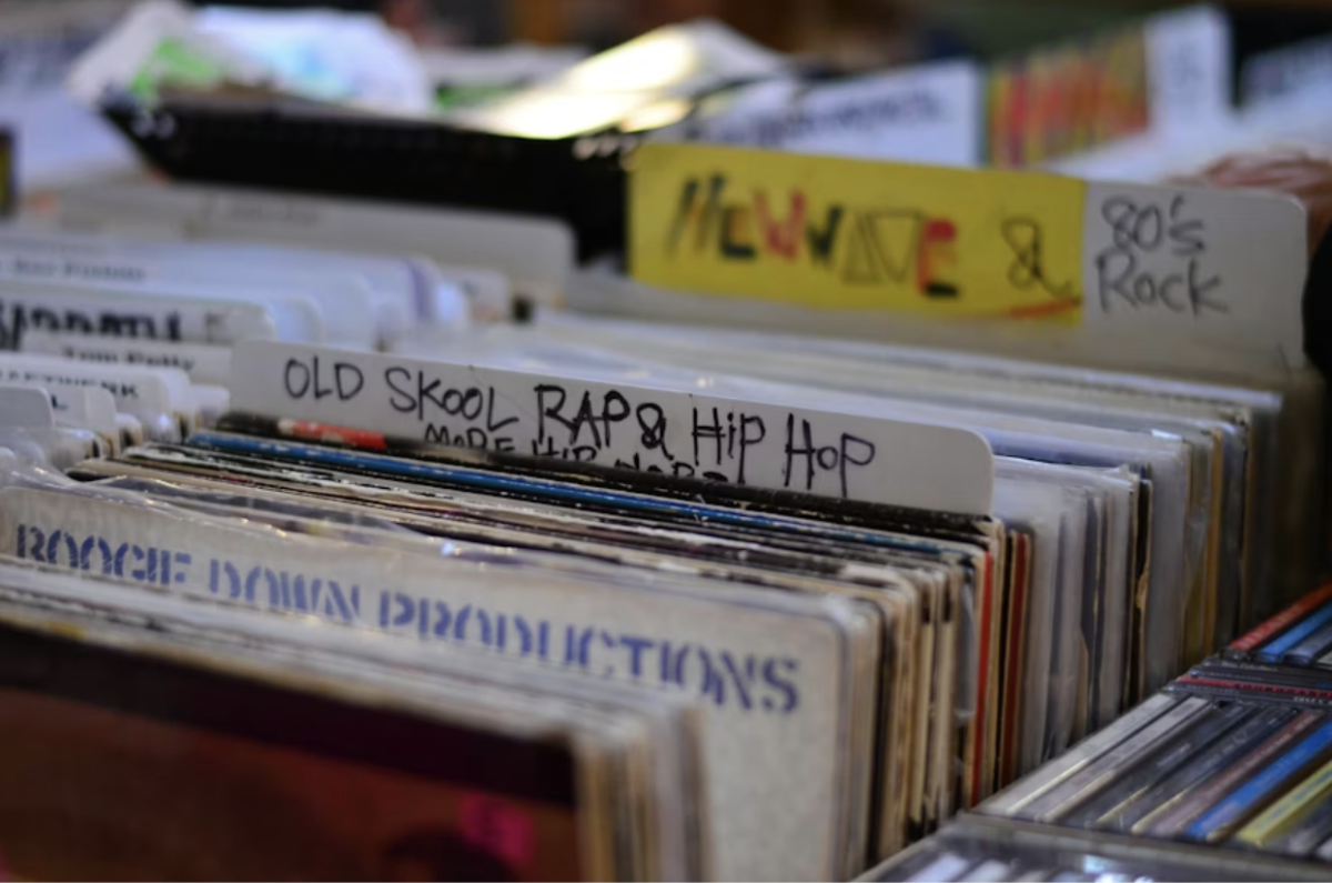 A collection of old school rap and hip-hop vinyls sits at a record store. Hip-hop has become one of the biggest styles of music, but as it’s grown so much, has the industry become overhyped? Photo used with permission of Erin Song via Unsplash.